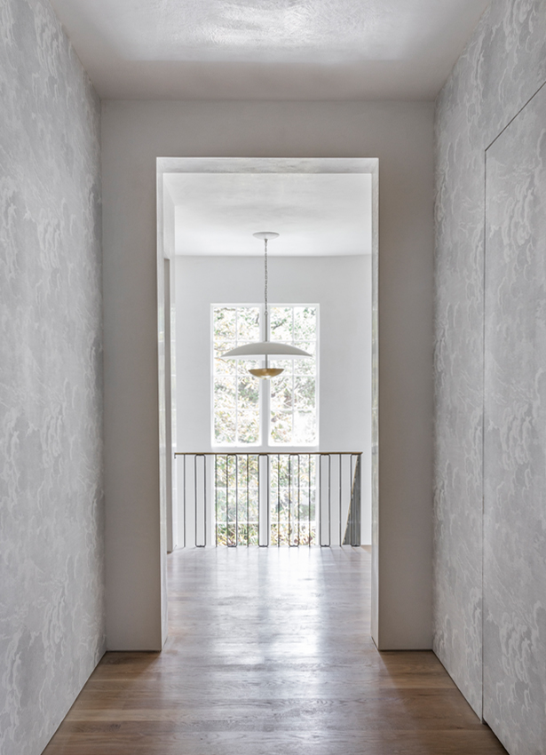 Bright Hallway with wooden floors and chandelier - Novo Designs Project